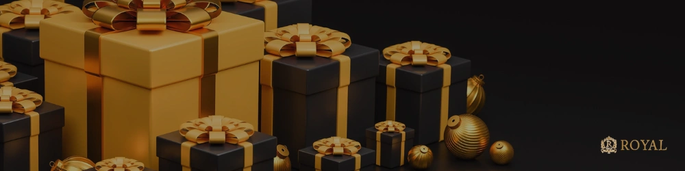 Black and gold gift box, gold-colored decorations, “ROYAL” logo in the lower right corner.